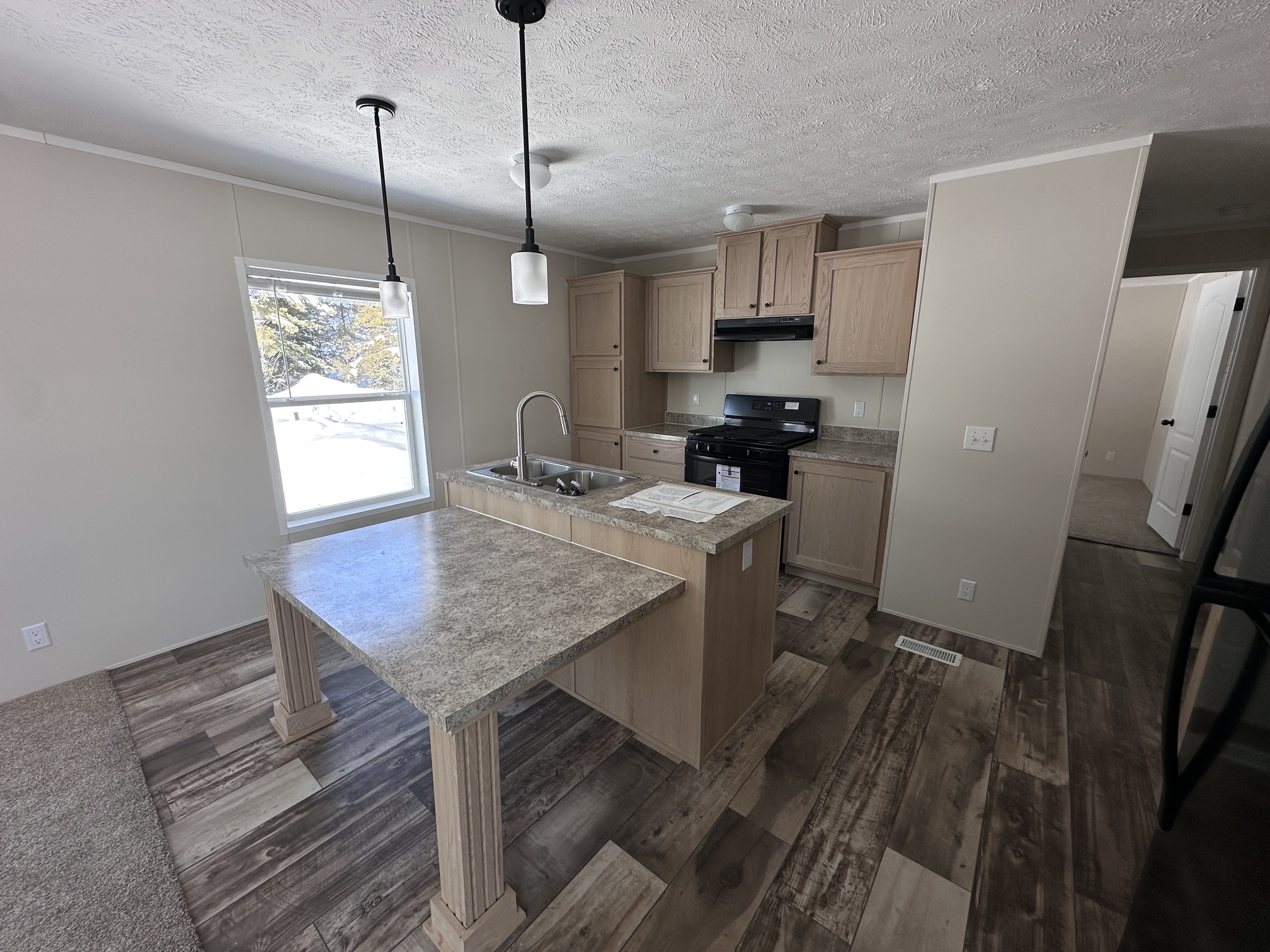 NEUTRAL KITCHEN WITH ISLAND AND OPEN FLOOR PLAN MOBILE HOME GWINN MI