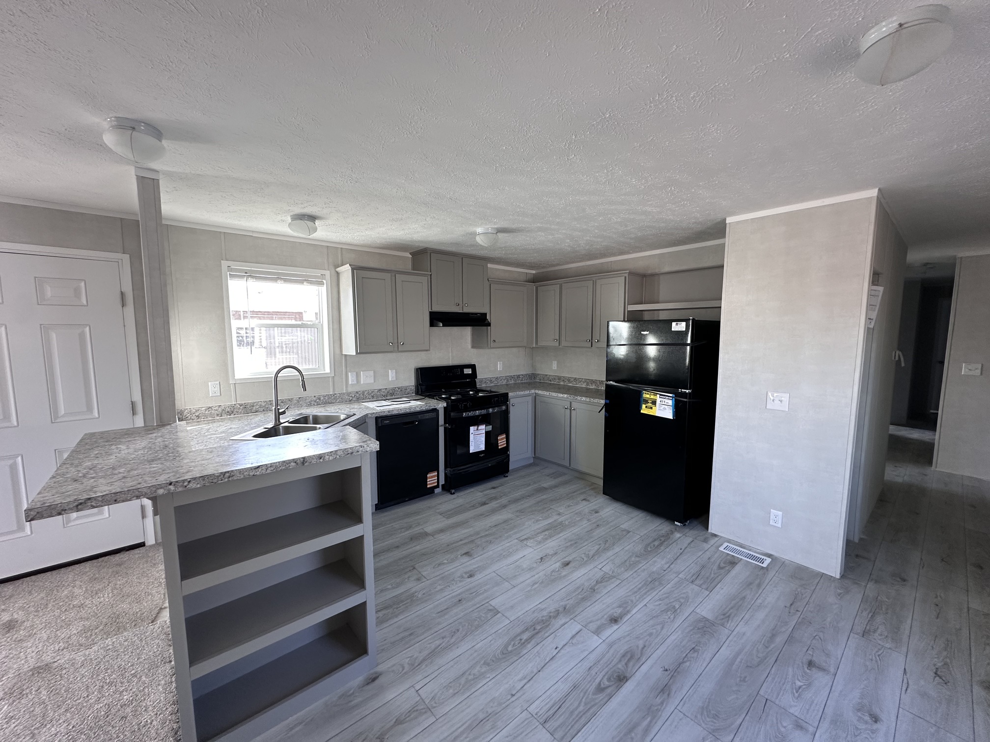 GREY KITCHEN WITH BLACK APPLIANCES MOBILE HOME GWINN MI